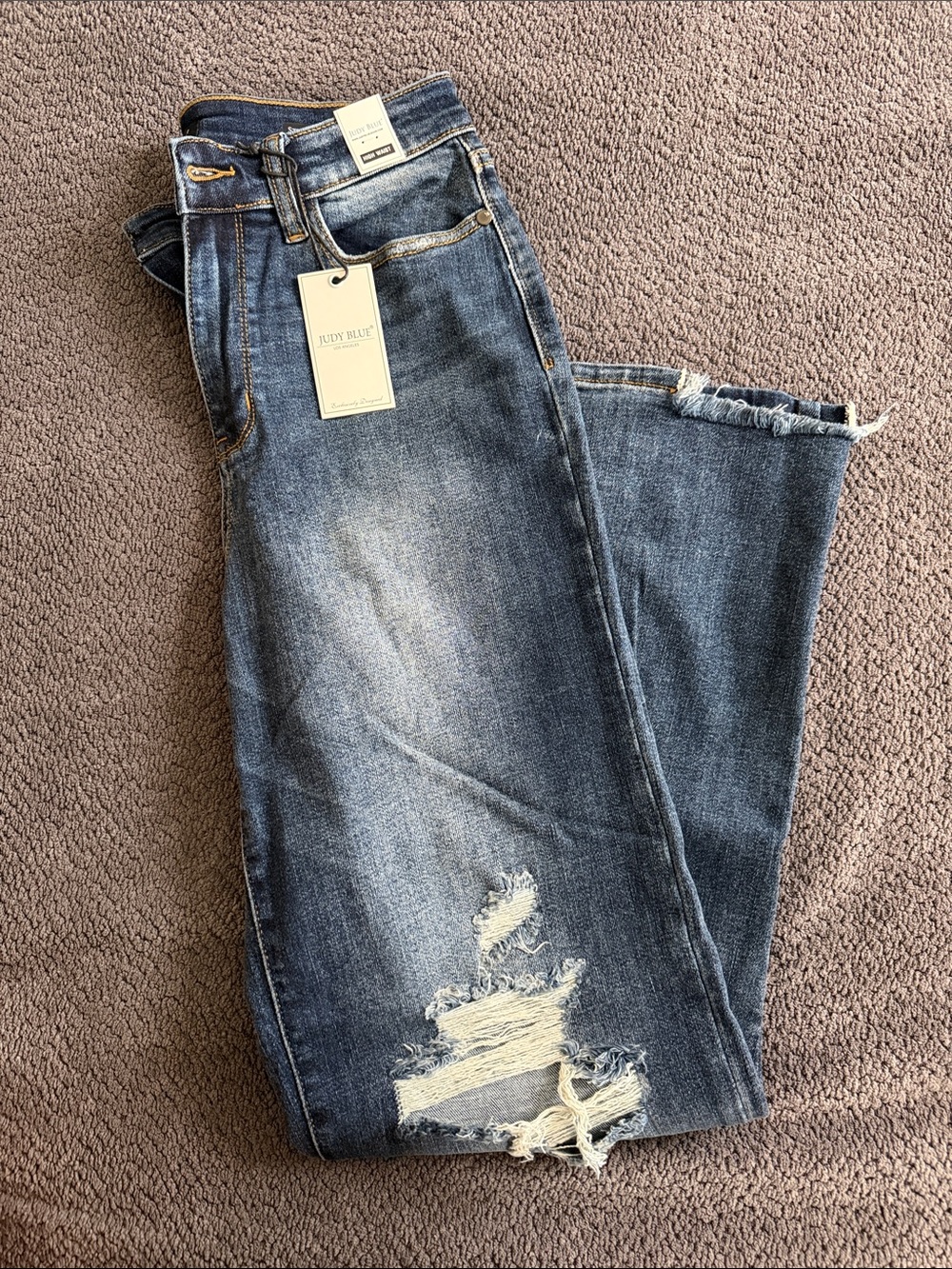 Judy Blue Faded Blue Straight Leg Jeans with Distressed Hem and Knee